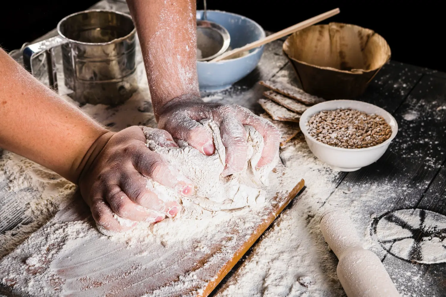 Freshly baked brioche loaf with various types of flour in bowls