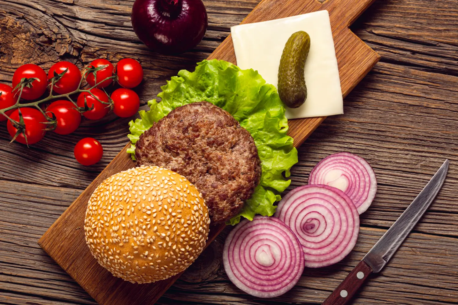 Juicy burger with melted cheese and fresh toppings on a brioche bun.