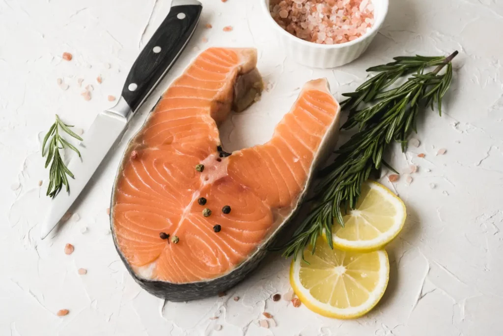 Fresh salmon fillet soaking in a lemon and herb brine