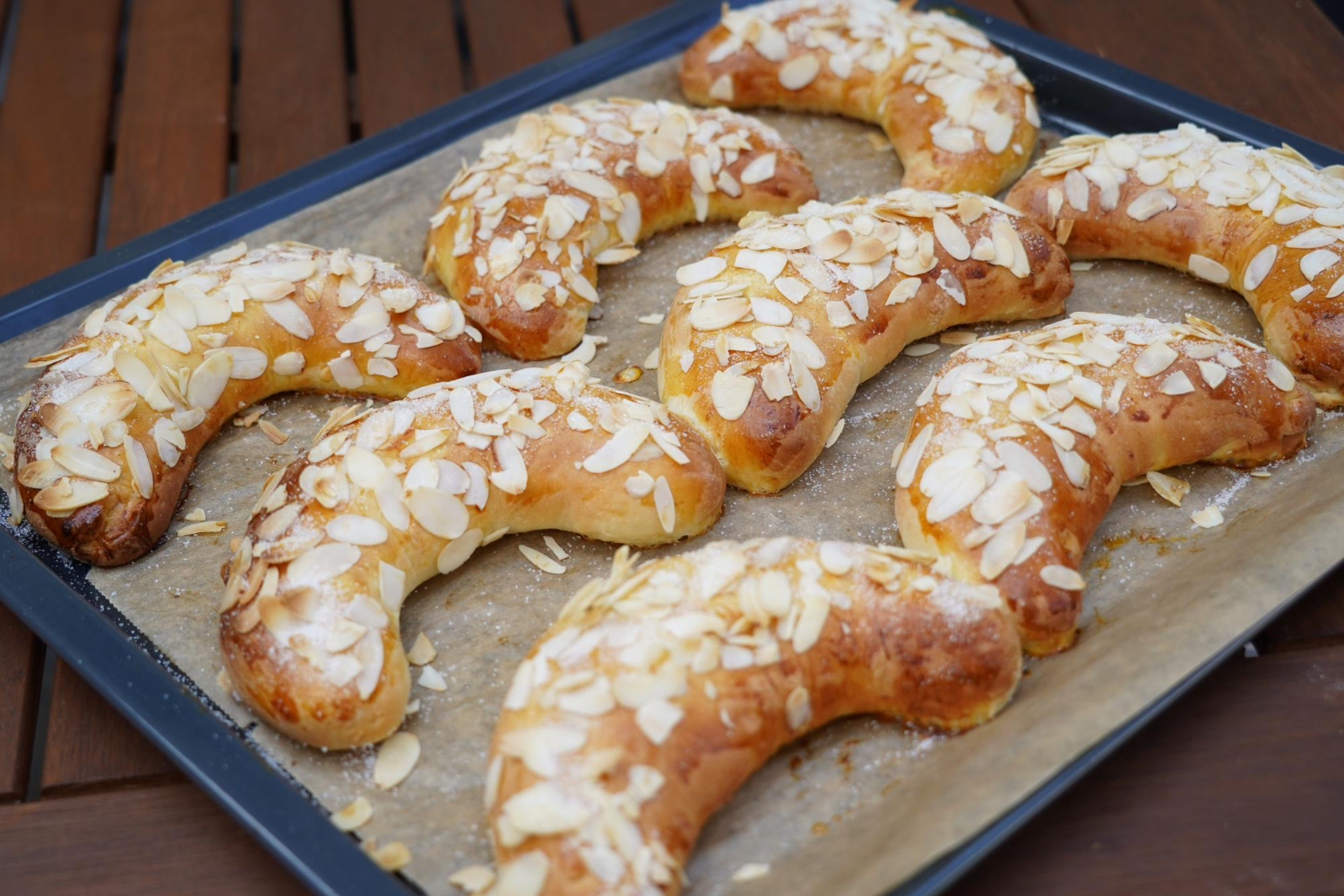 Golden-brown Mandelgipfel on a wooden table