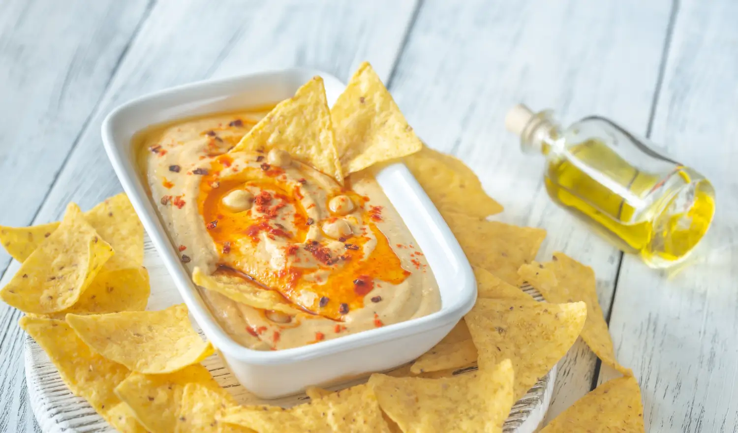 Bowl of homemade chipotle queso with tortilla chips