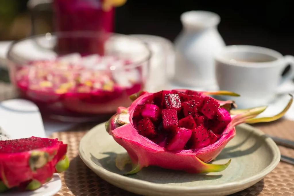 Assortment of dragon fruit bowls, smoothies, and tropical fruits.