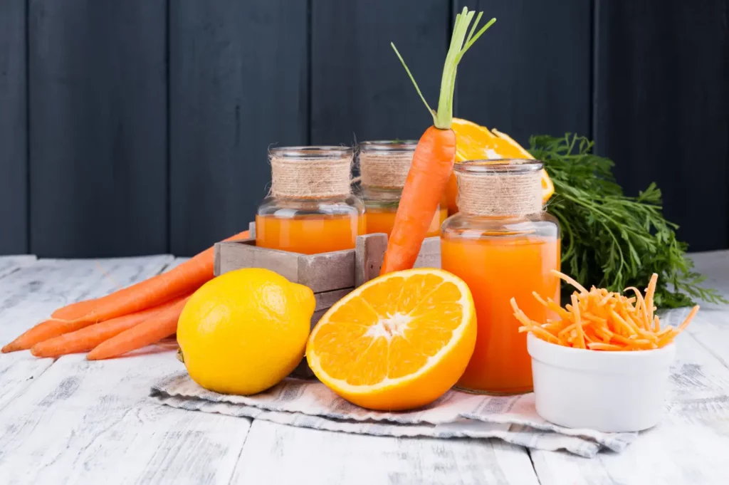 Carrot and tropical fruit smoothie with fresh ingredients