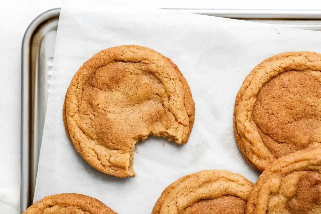 Snickerdoodle cookie dough balls rolled in cinnamon sugar