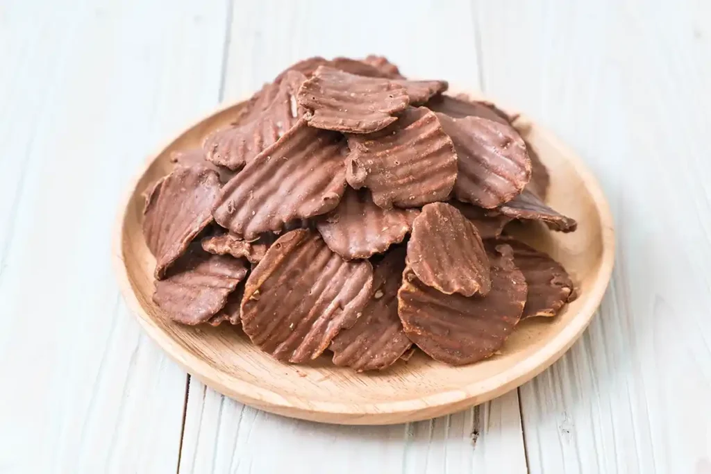 Chocolate-covered potato chips with toppings.