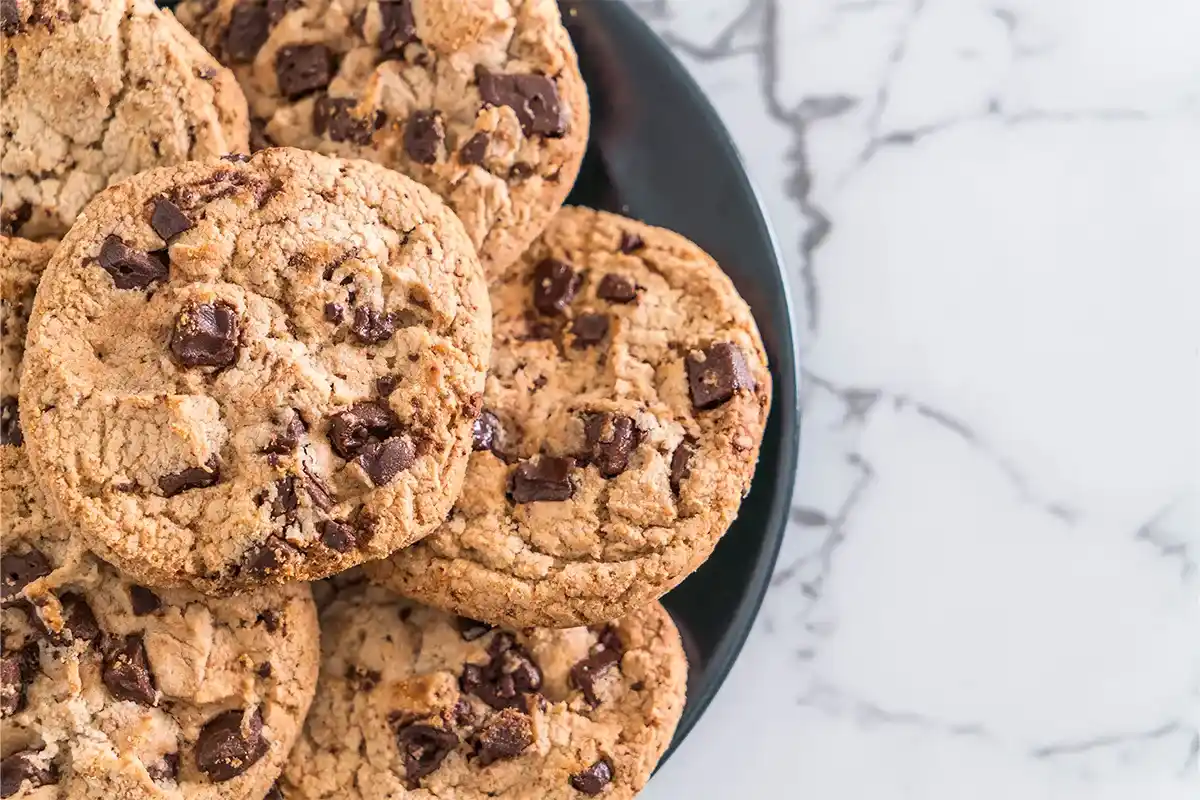 Freshly baked small batch chocolate chip cookies on a cooling rack