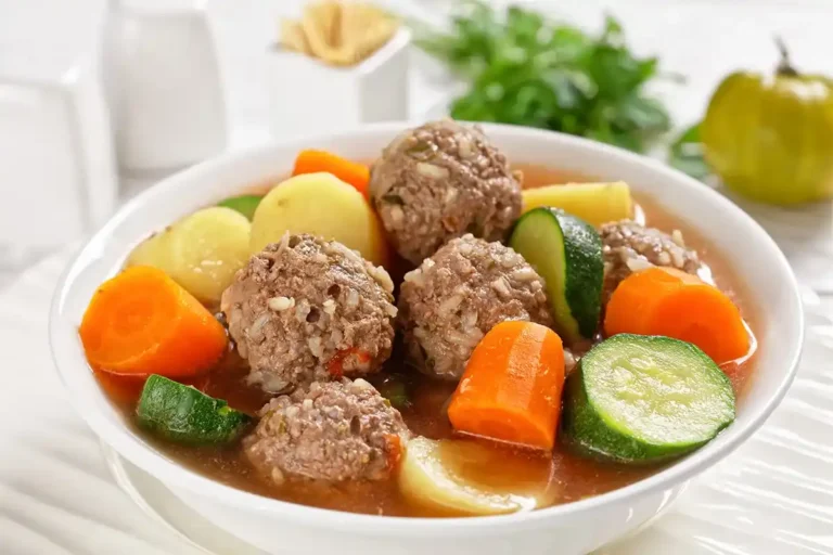 A bowl of homemade Albondigas soup with meatballs and vegetables