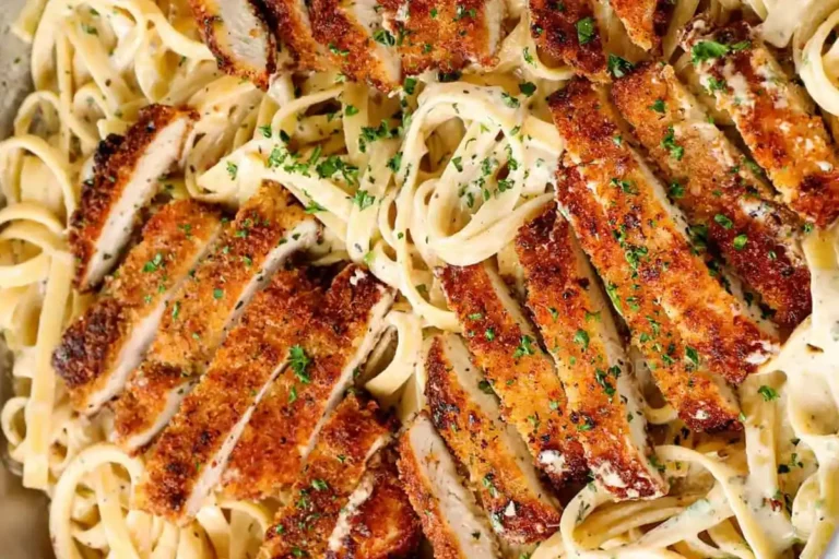 Overhead shot of crispy breaded chicken with fettuccine Alfredo