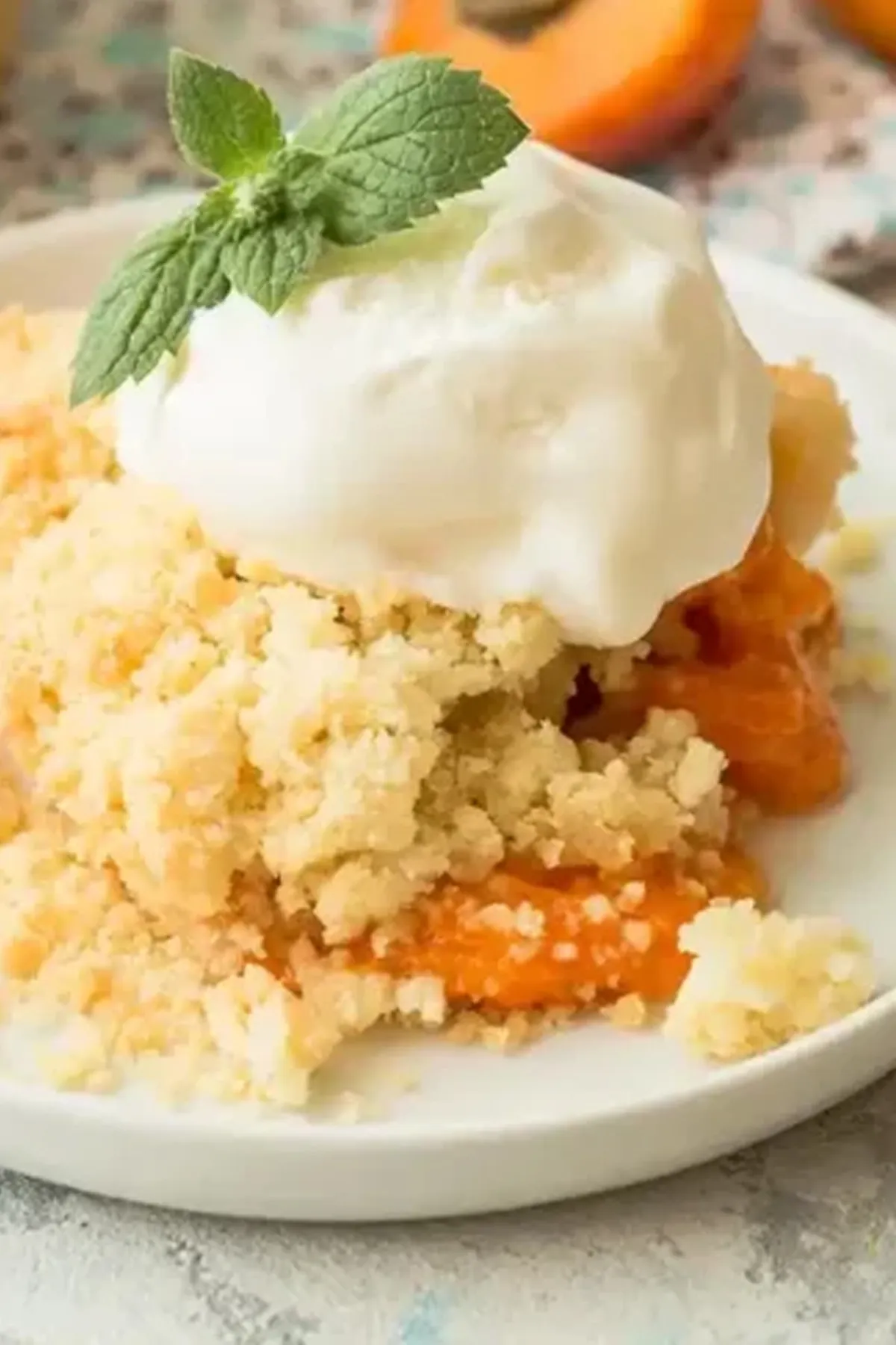 Peach Cobbler Recipe Golden peach cobbler with cake mix crust and vanilla ice cream